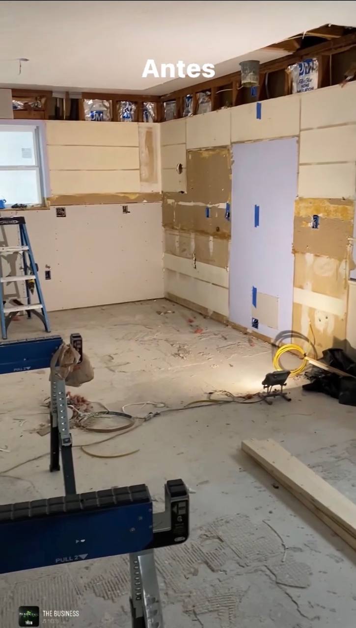 Kitchen gut — exposed framing, bare subfloor, work in progress
